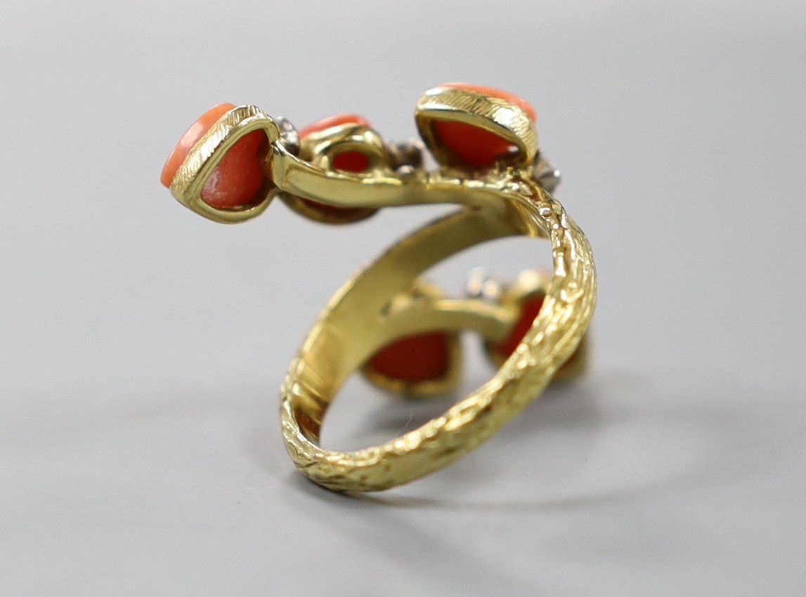 A 1970's modernist 18ct gold, five stone heart shaped coral and five stone diamond set dress ring, maker's mark, LAB, size L/M, gross weight 7.8 grams.